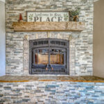 Beautiful stone fireplace in vacation home with mountain views by A River Runs Thru It