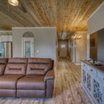 Living room, kitchen and entry hall of vacation home with mountain views