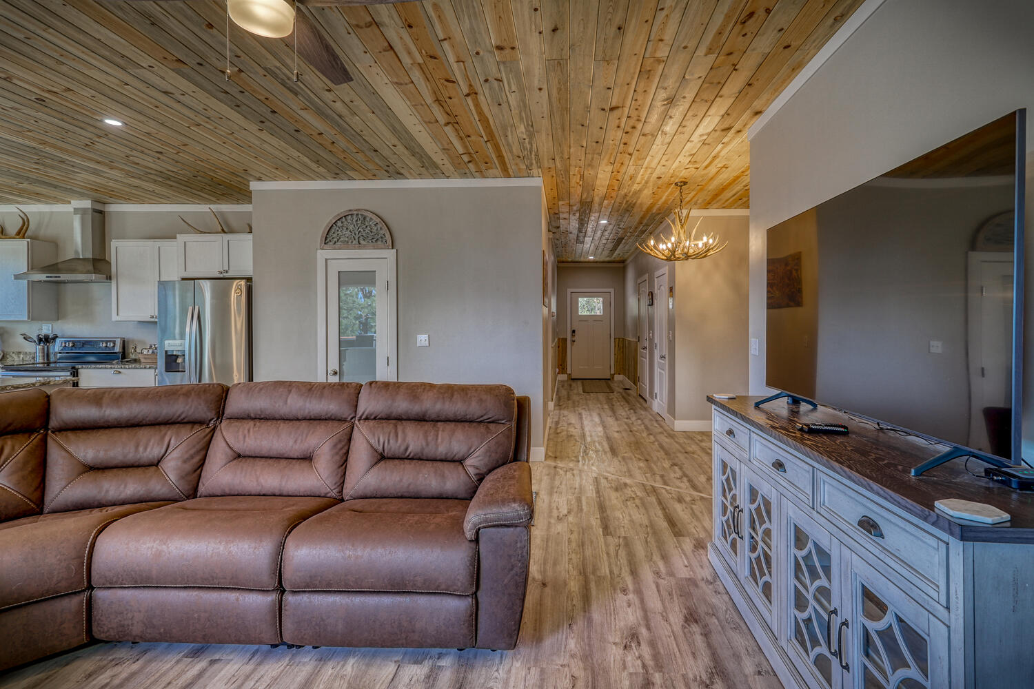 Living room, kitchen and entry hall of vacation home with mountain views