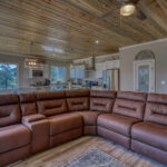 Open-concept living room and kitchen in vacation rental with great mountain views by A River Runs Thru It