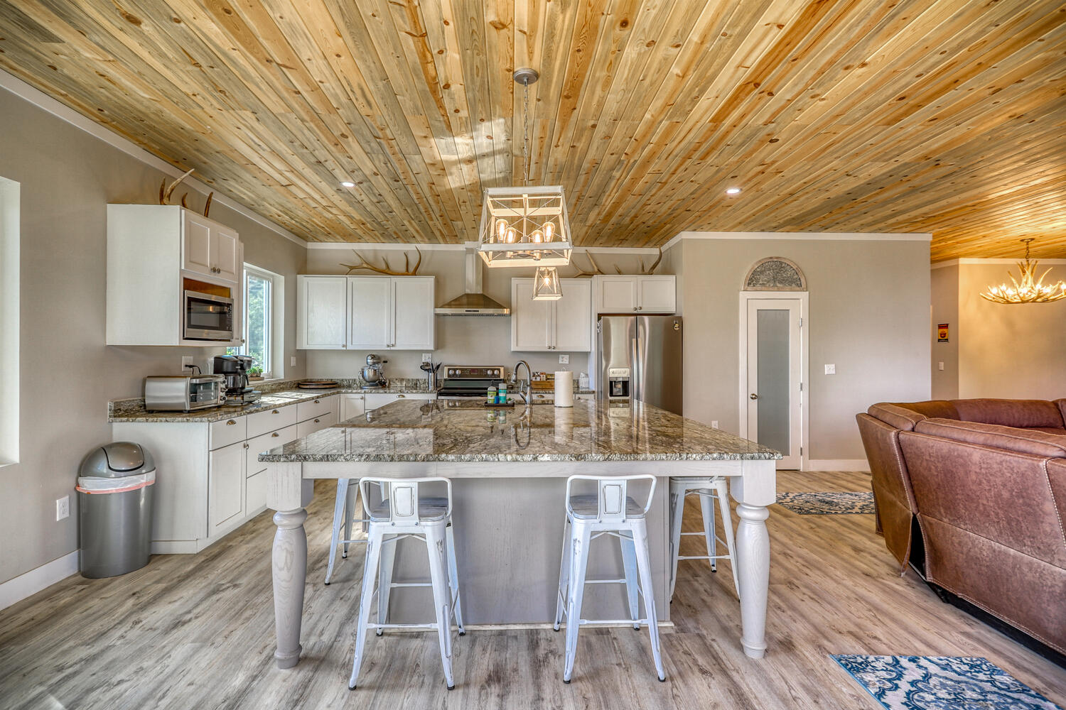 Open-concept kitchen and living room in vacation rental with great mountain views by A River Runs Thru It