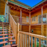 Back wrap-around patio at Eagle's View vacation rental home on 4 acres by A River Runs Thru It
