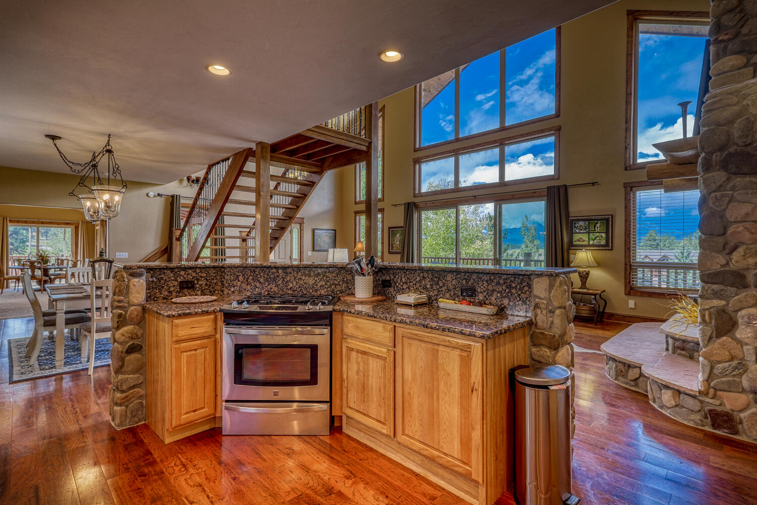 Kitchen and dining areas with living room overlooking mountains at Eagle's View vacation rental
