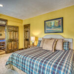 Third bedroom on 1st floor with king bed, adjacent to game room with ping pong table, at Eagle's View in Pagosa Springs